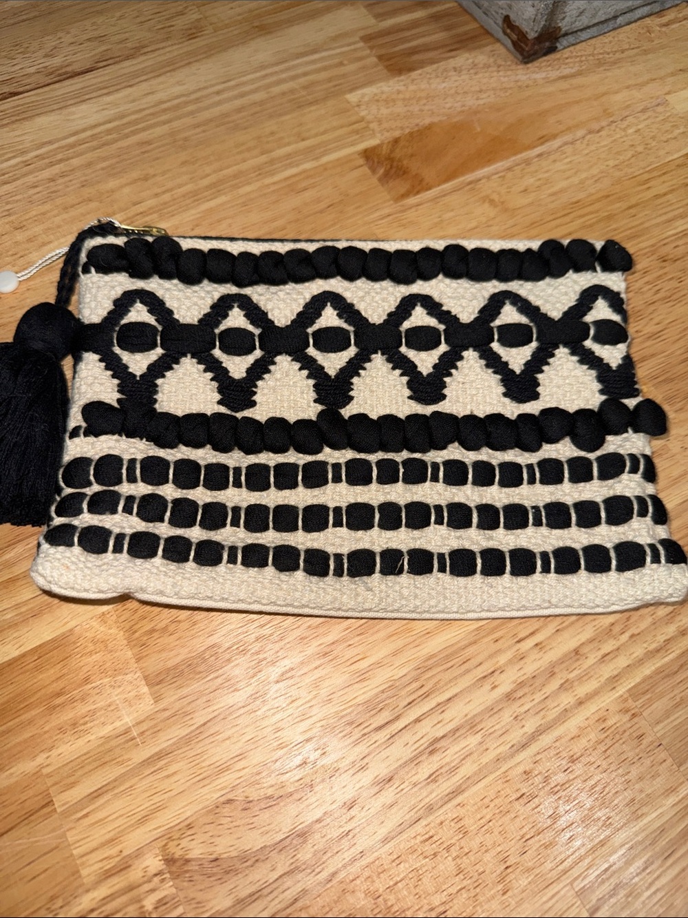 Mud Pie Black & Cream Woven Tassel Zip Clutch